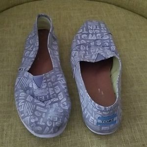 Gray and white canvas shoes